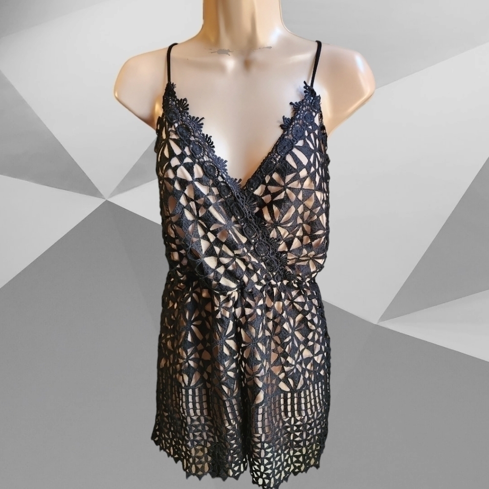 CHARLOTTE RUSSE geometric cut-out romper....